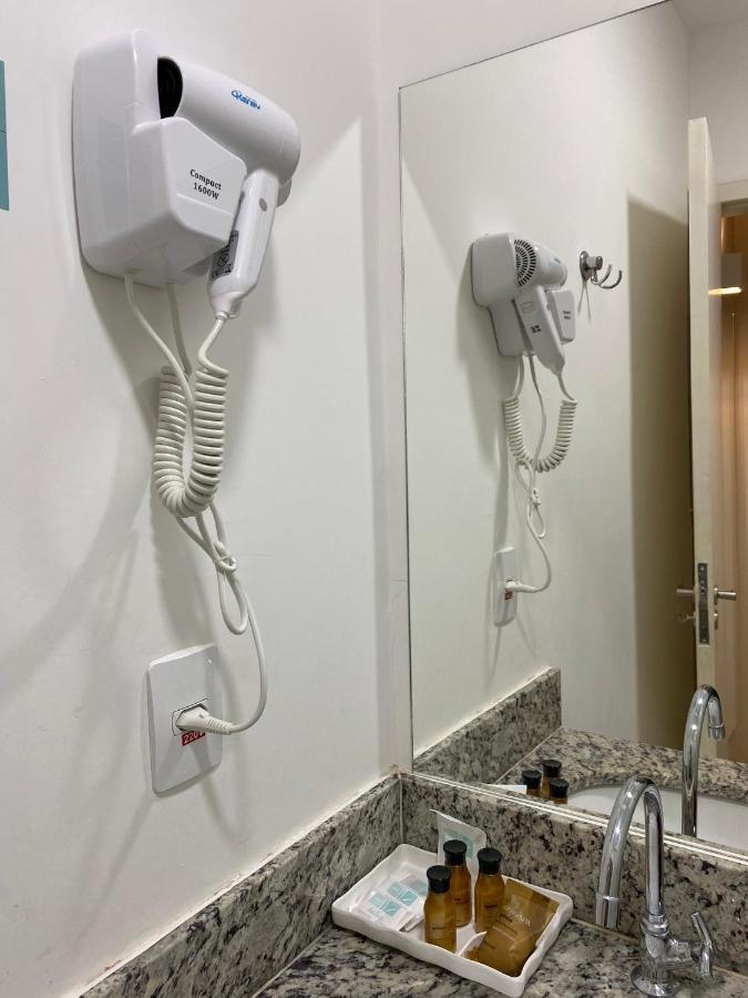Hotel H2 Congonhas Bagian luar foto A hair dryer in a hotel room